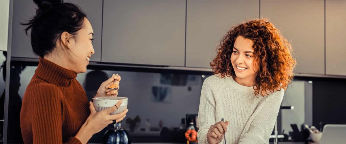 Women having a conversation in the kitchen during sober living in Nashville, TN.