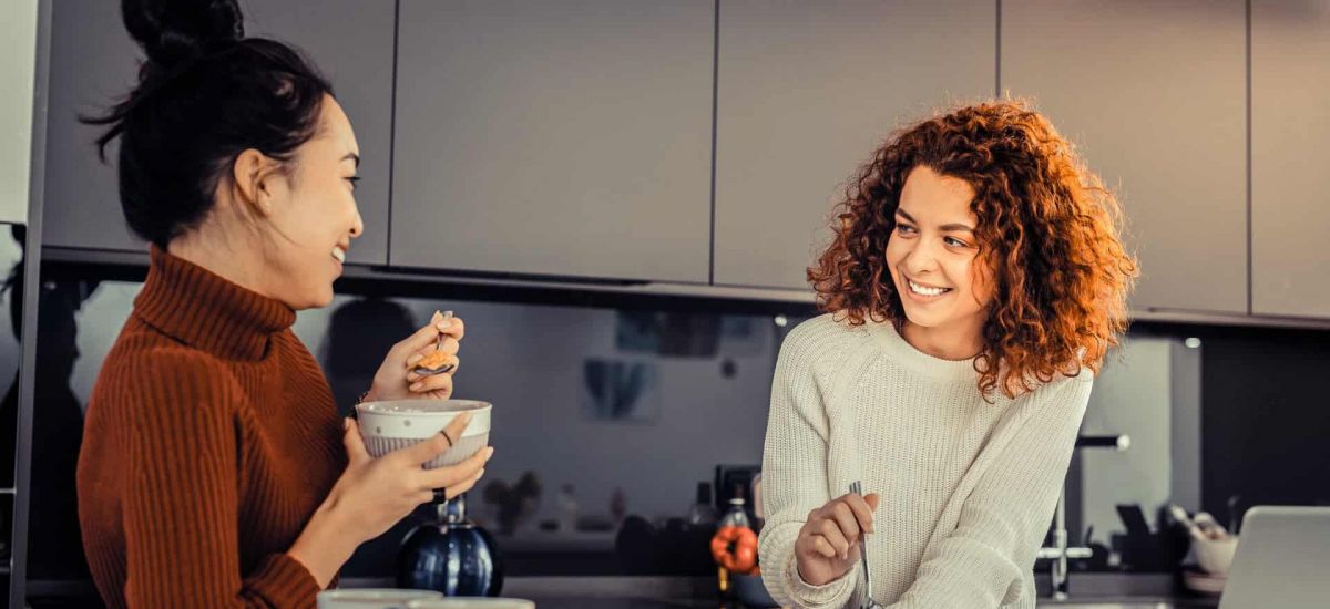 Women having a conversation in the kitchen during sober living in Nashville, TN.