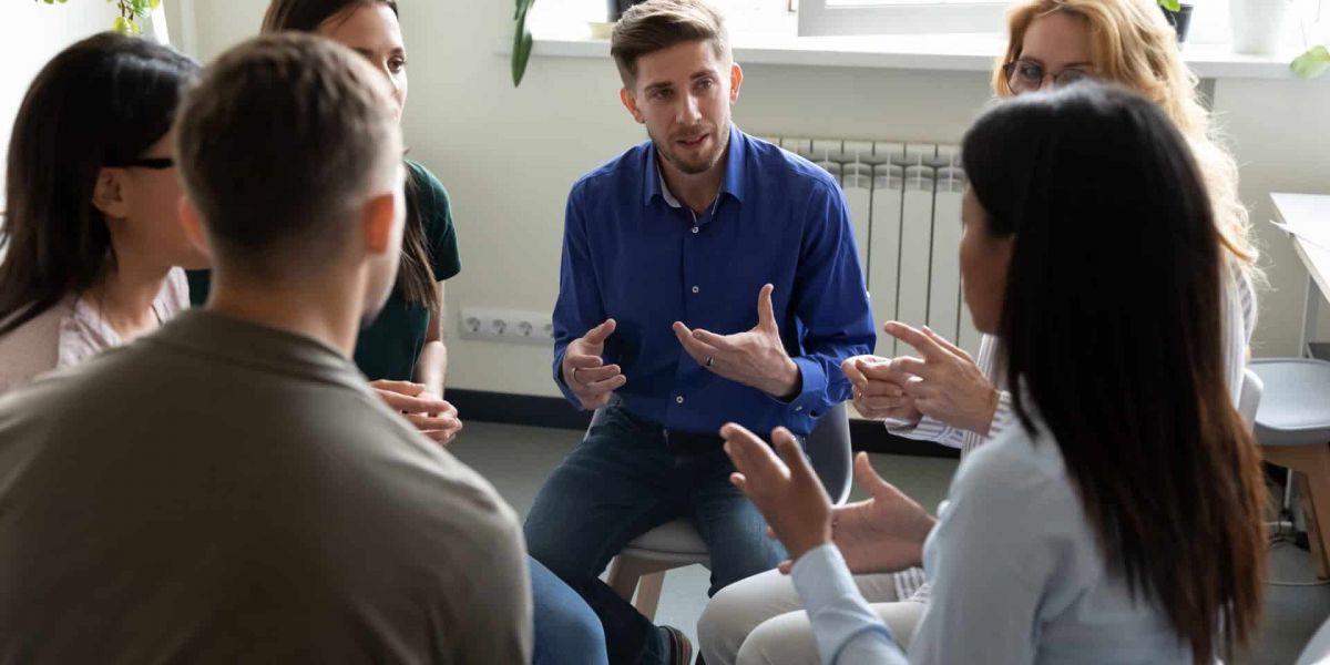 A group participates in group therapy through CHAMPVA for rehab in Nashville.