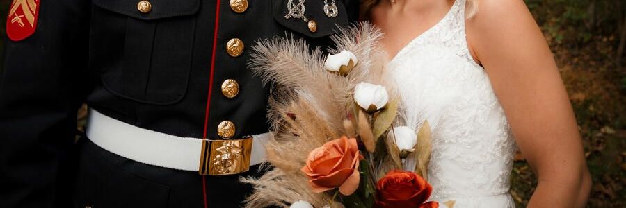 a man in his military uniform on his wedding day with his wife