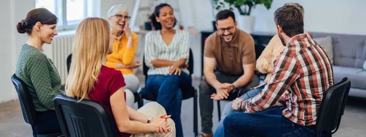 People sharing valuable experiences during a group therapy session at rehab in Chattanooga, TN.