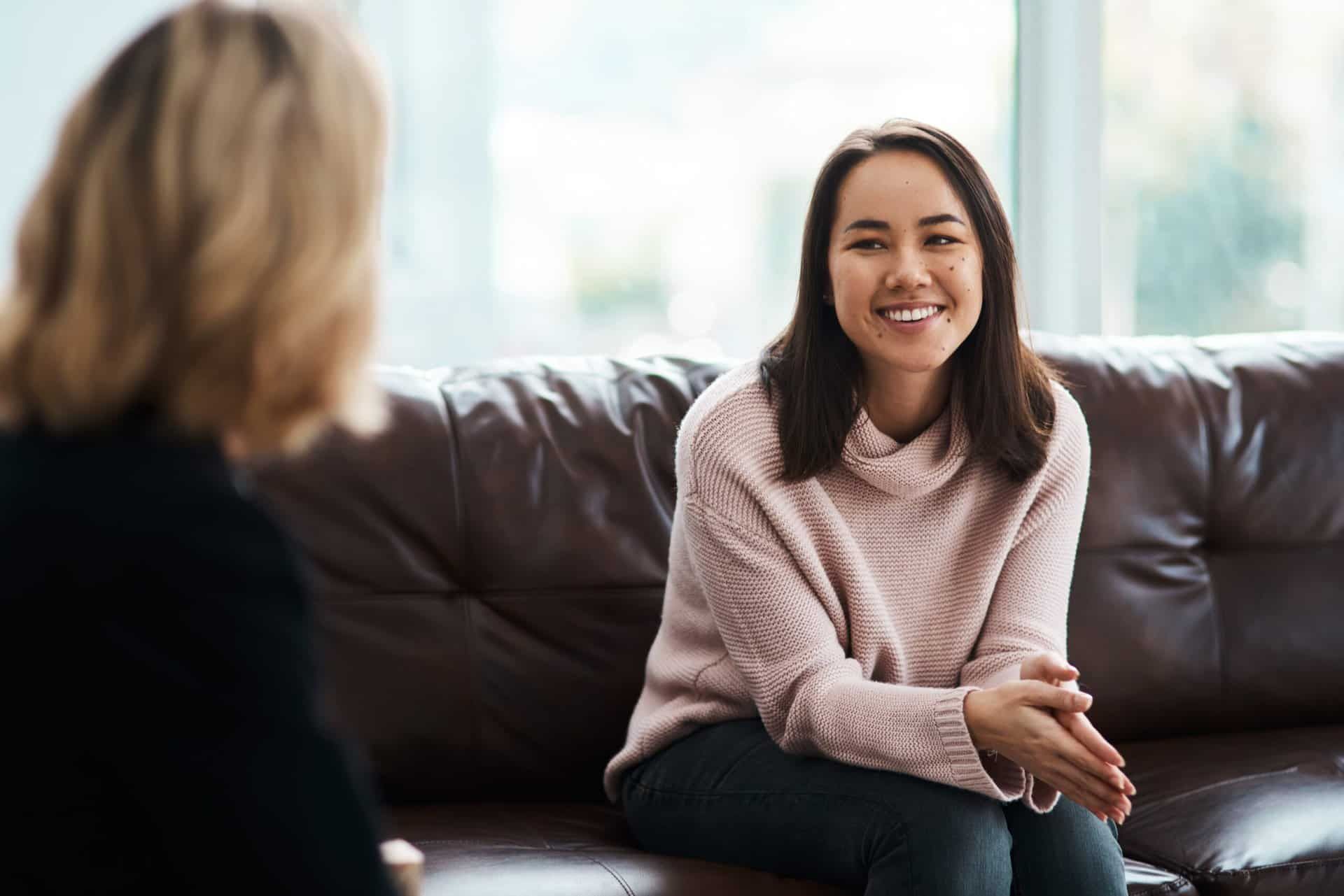 women smiling during therapy session for her drug addiction